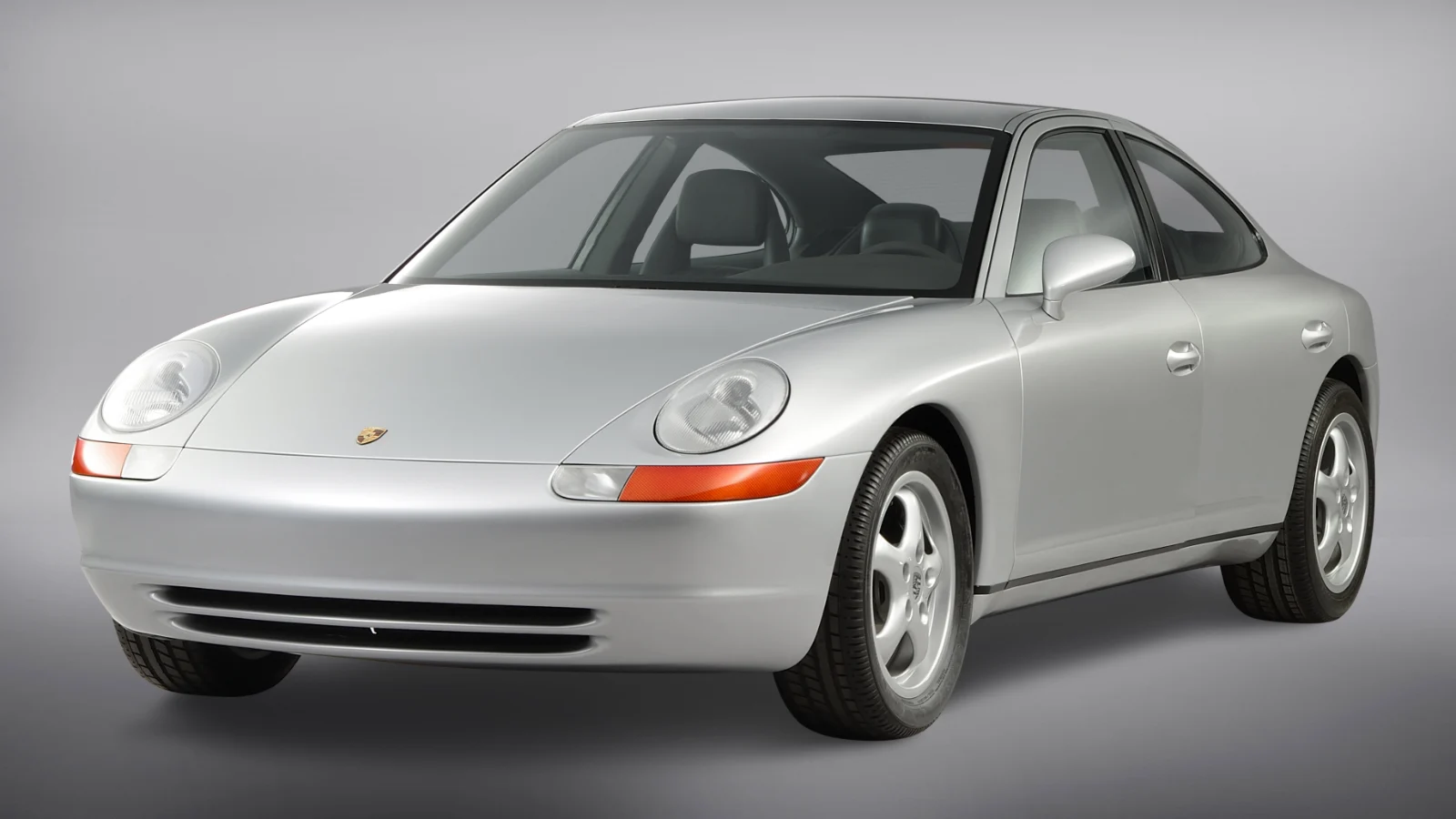 Silver Porsche 989 four-door prototype in a studio