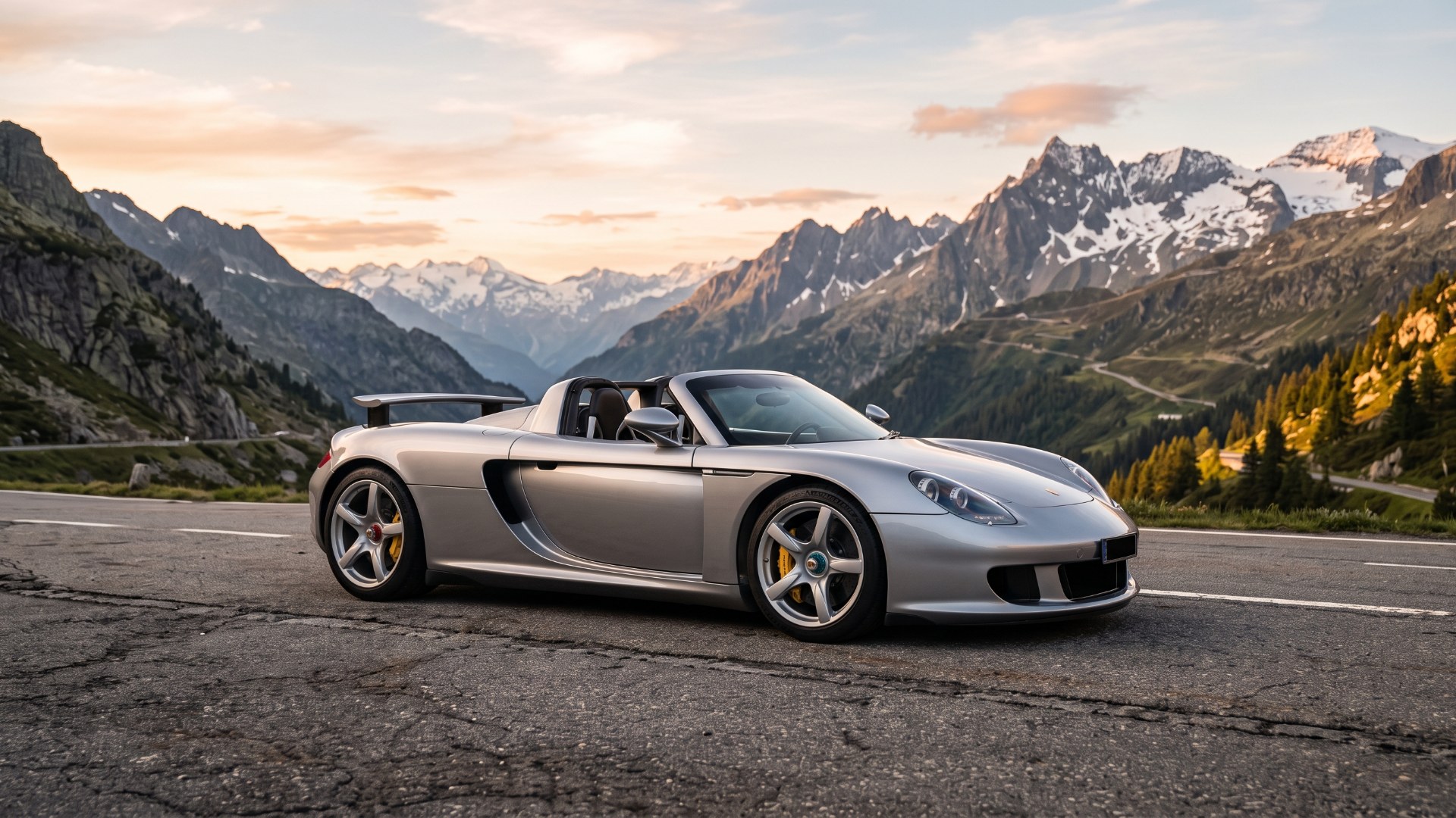 Silver Porsche Carrera GT parked on an alpine pass