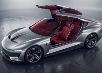 Illustration of a low silver electric grand tourer concept with its one-piece roof raised over a red leather cabin