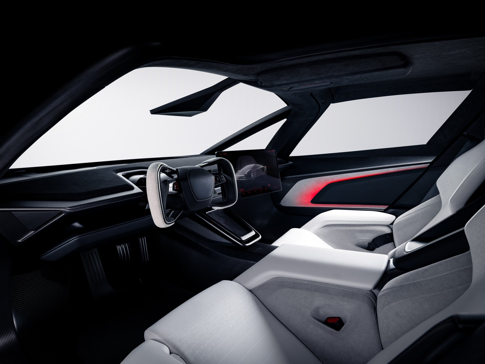 Tesla Roadster cockpit with yoke steering wheel and white bolstered seats