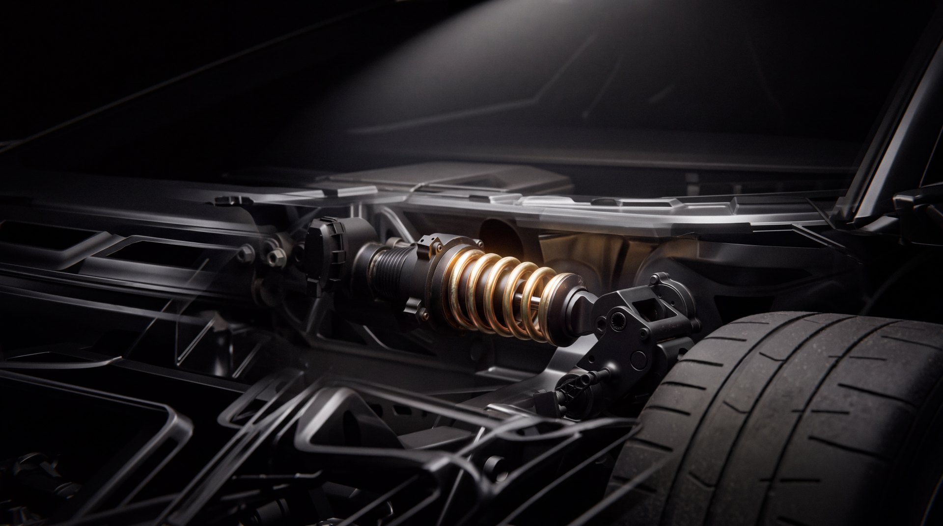 Close-up of a Tesla Roadster suspension corner with a gold coil-over damper mounted beside the tire